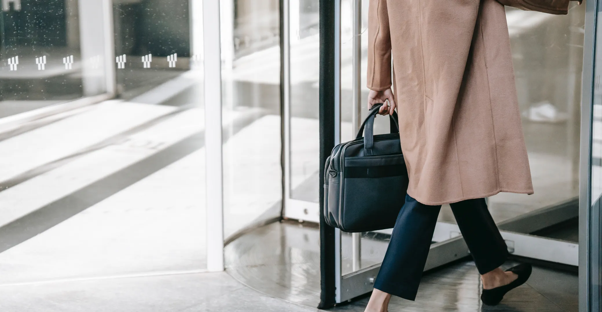Business woman carrying a briefcase, symbolizing professionalism, and readiness
