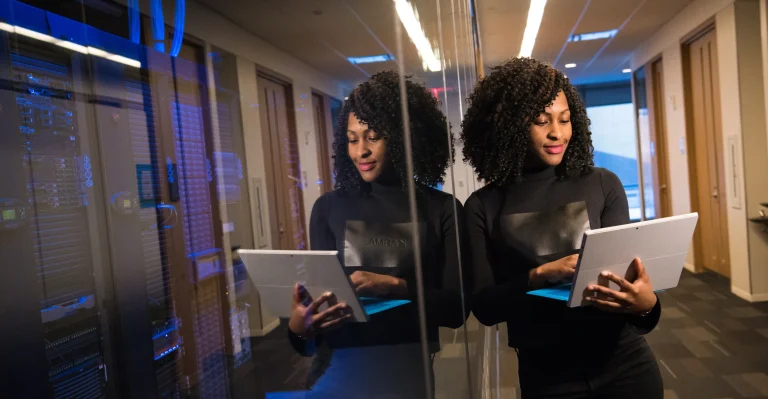 Business woman managing her business activities on a laptop