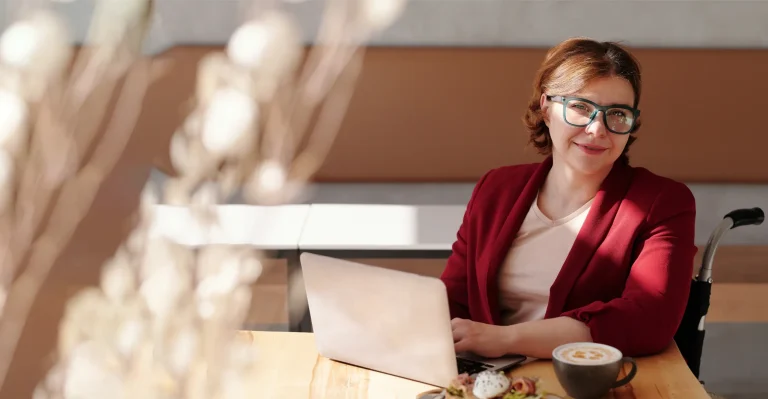 Business person managing her business on a laptop