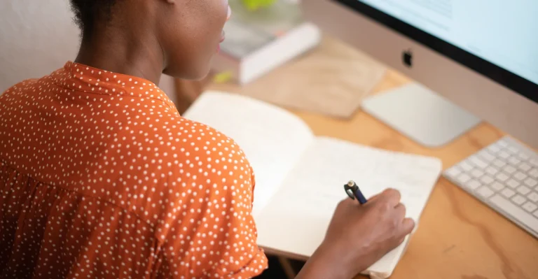 Businesswoman organizing and taking records