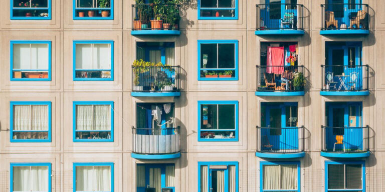 Facade of modern apartments, illustrating a key aspect of real estate finances and property investment