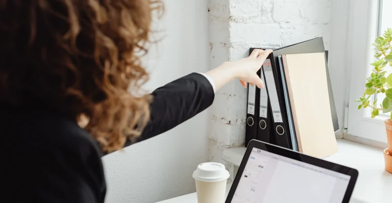 Focused business person diligently organizing and filing records