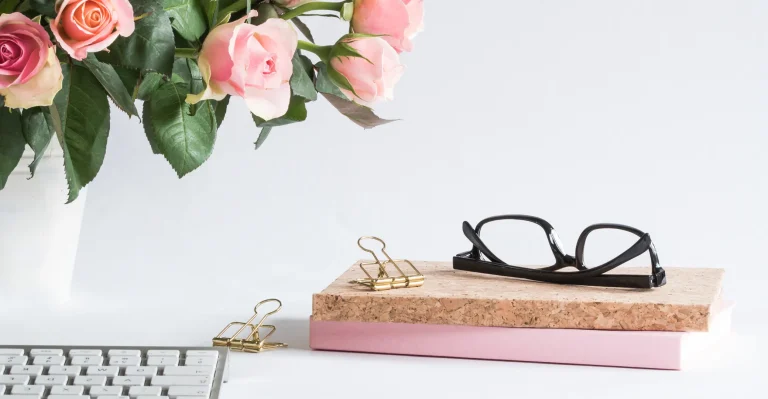 Glasses placed on a set of notebooks
