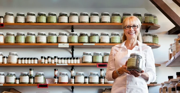 Shop owner showcasing her products