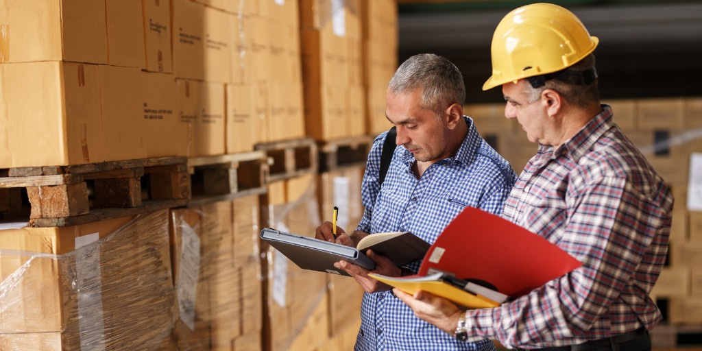 Warehouse workers checking inventory