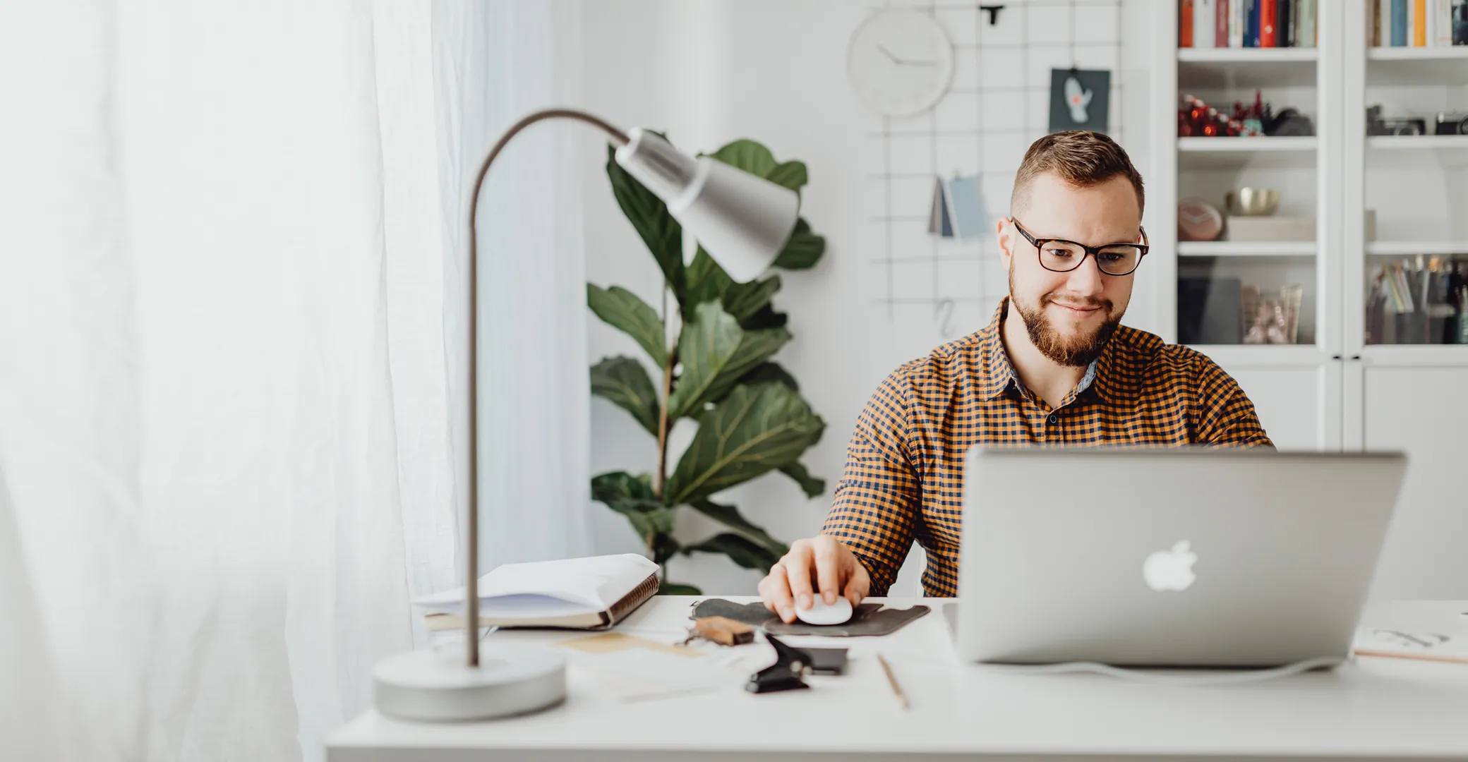 Businessman working on a laptop with contentment